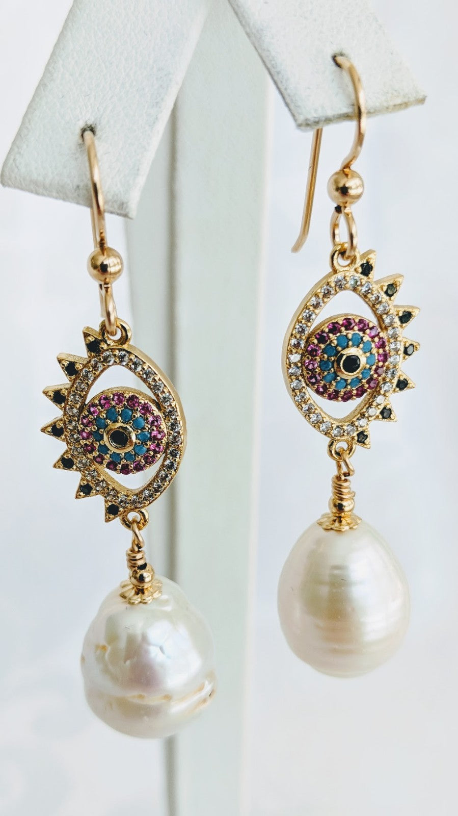 Ringed pearl with gold and cubic zirconia evil eye