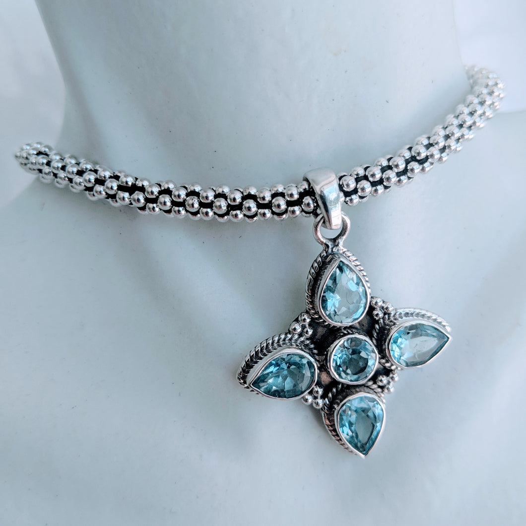 Blue Topaz and Sterling silver 4 point pendant