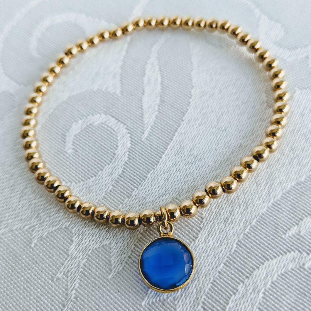Gold balls with blue onyx