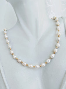 Elegant Baby Baroque pearl necklace with gold accents