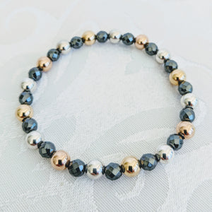 Faceted Hematite with gold, rose gold & silver