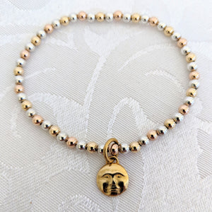 Silver, gold and rose gold calls with moonface charm