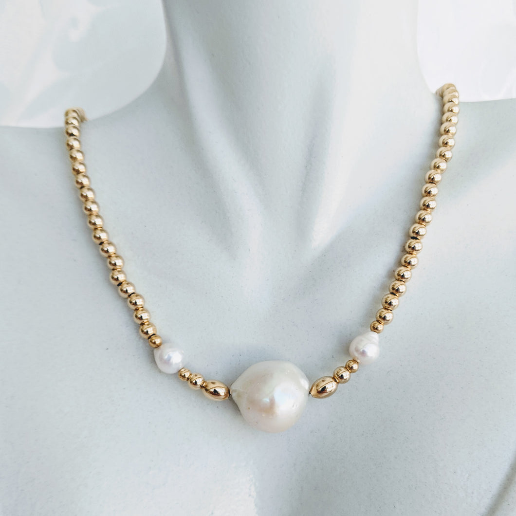 Gold ball and pearl necklace