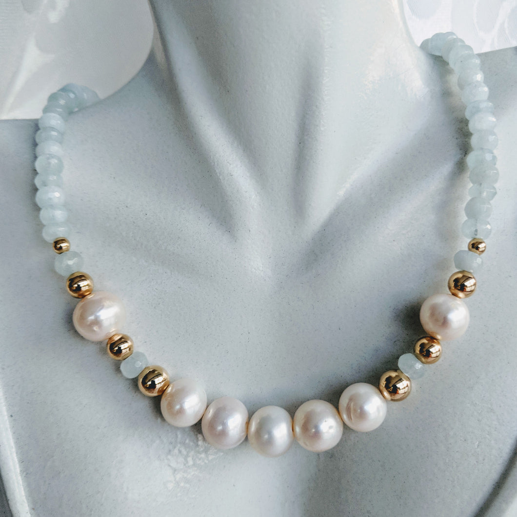 Faceted Aquamarine with pearl and gold